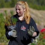 One of the Cascade High School students who helped us plant 1,950 trees in one day up at the site Svg+xml,%3Csvg%20xmlns%3D%22http%3A%2F%2Fwww.w3.org%2F2000%2Fsvg%22%20width%3D%2